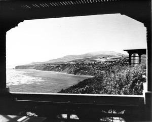 A view of the Southern California coast, with houses on the hills above the ocean