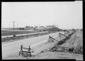 Paving Slauson Avenue, salesmen studying for test, Southern California, 1929