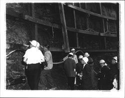 Reporters at bottom of nuclear reactor hole in Bodega Head, Bodega Bay, California, 1963