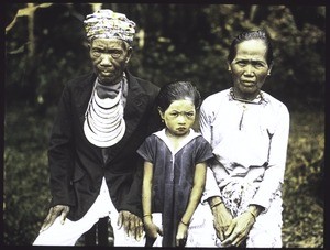 Dajak chief with his wife and a granddaughter