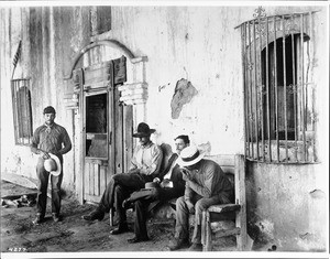 Four Californians near the entrance of Mission San Fernando, California, 1924
