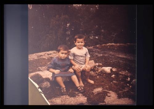 Photograph of two little boys seated outdoors