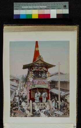Scene of a festival cart with costumed people in Kyoto