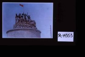 Poster depicting Iranian soldiers holding red flag aloft