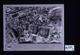 This is Rostock. An R.A.F. reconnaissance photograph of the Heinkel works at Rostock, heavily bombed in April, 1942. Note specially main assembly shop with roof damage and broken wall (lower right-hand) and salvaged fuselages, aircraft parts, etc. The Rostock raids occurred in period of intense R.A.F. activity during which severe attacks were made on Kiel and Lubeck, the Renault Works at Paris were destroyed, and Germany's third city, Cologne, was devastated by over a thousand bombers in ... [text in Arabic]