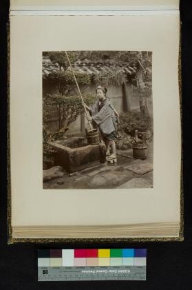 Scene of a woman drawing water at a well