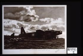 Loading up as dusk falls. This "Wellington" is about to take off for a moonlight raid on Germany. [in Arabic]