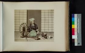 Portrait of a woman at a spinning wheel