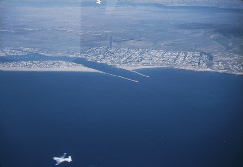 Aerial view of Newport Beach, California, jetties and the surrounding area near the beach. January 1952