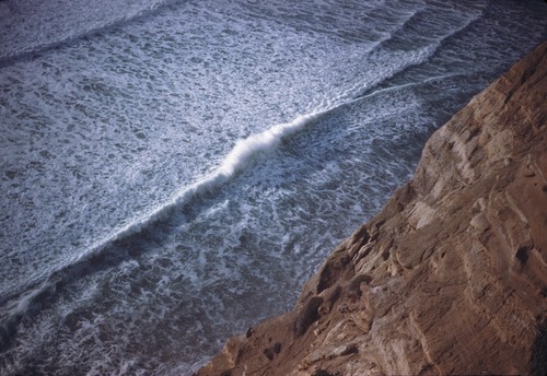 Reflected wave meets incoming breaker off cliffs north of Scripps XII-25-45 About 1500