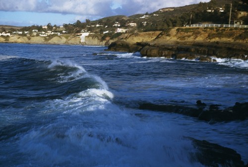 Ocean breakers hitting the coastline near La Jolla cove. April 20, 1953