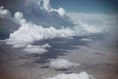 Cu clouds over Sonora Desert E. of Tiburon Is., Gulf of Calif. VII-27-52 c. 1530