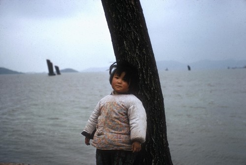 Child by a Lake