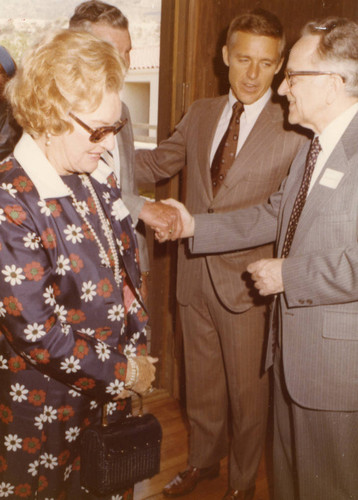 Justice Harry A. Blackmun and President Banowsky greeting two guests (Color)