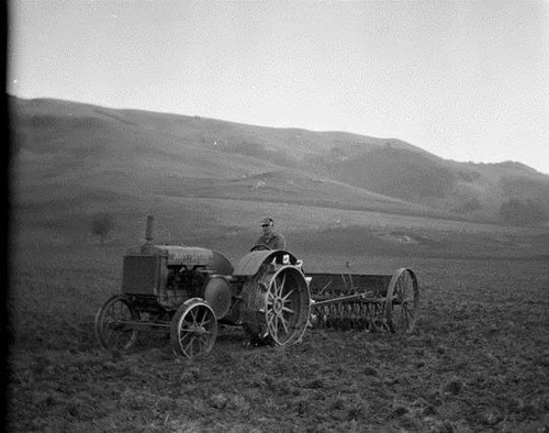 Boyd Stewart Planting Oats and Forage Crop Test Plots/Seeder and Seed Sack, Stewart Ranch, Nicasio, Marin County, December 1930 [photograph]