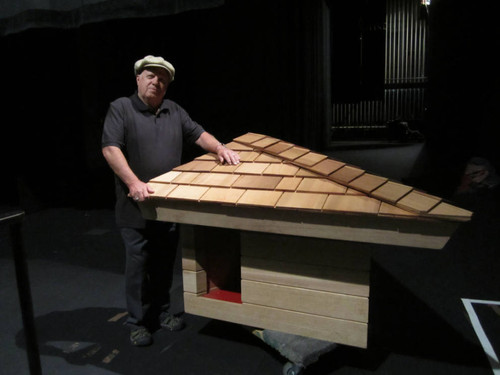 May, 2016 photograph of Jim Berger donating the doghouse he built, designed by Frank Lloyd Wright [photograph]
