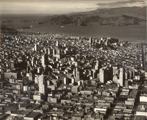 A view from San Francisco of the Golden Gate before the bridge was completed, with the north (Marin) tower visible in the far distance, November, 1934 [photograph]