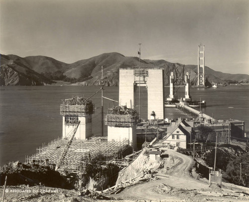 The south (San Francisco) tower and the south tower pier, with the north (Marin) tower in the background, during the construction of the Golden Gate Bridge, February, 1935 [photograph]