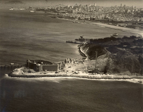 Looking toward San Francisco, with Fort Point in the foreground, as construction on the Golden Gate Bridge begins, circa December 1933 [photograph]