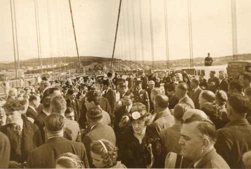 A crowd of invited guests celebrate the completion of the Golden Gate Bridge at the "Last Rivet" Ceremony, April 27, 1937[photograph]