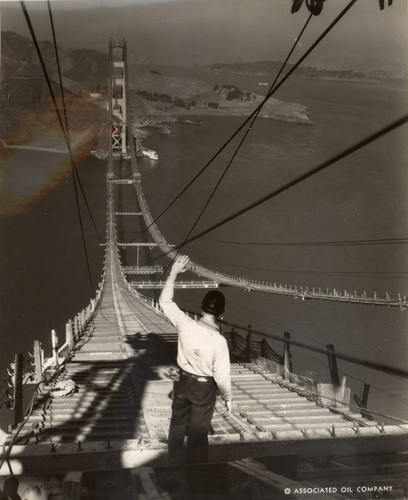 Catwalks connecting the two towers of the Golden Gate Bridge during its construction, October, 1935 [photograph]