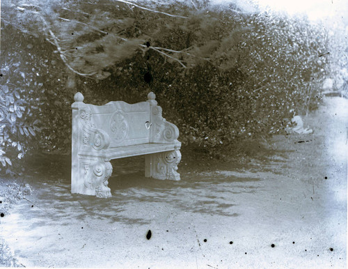 A stone bench in the garden at Marin Junior College in Kentfield, Marin County, California, circa 1930 [photograph]