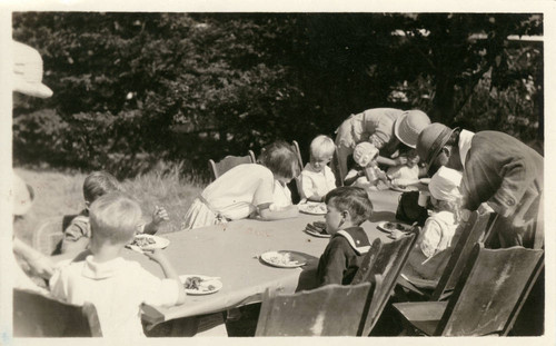 Children eating lunch at the annual Grape Festival at the Kent Family home, circa 1921 [photograph]