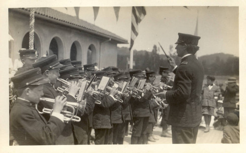 Trumpeters perform on stage in front of the Tamalpais Centre clubhouse at the second annual May Day celebrations in Kentfield, California, May, 1910 [photograph]