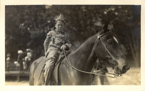 A boy on horseback and in costume during the second annual May Day celebrations in Kentfield, California, May, 1910 [photograph]