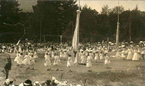 Children assembling to dance around the may poles, Kentfield May Day Celebration, circa 1911 [photographic postcard]