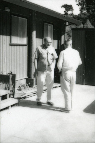 Long-time Marin City resident and community leader Jesse Berry at his new house, with a guest, circa 1963 [photograph]