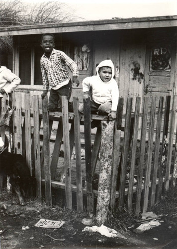 Children in front of World War II-era housing in Marin City, California, circa 1960 [photograph]