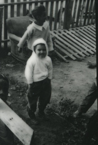 Children in front of World War II-era housing in Marin City, California, circa 1960 [photograph]