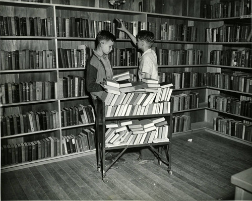 Children choose materials at the Marin City Branch of the Marin County Free Library, circa 1955 [photograph]