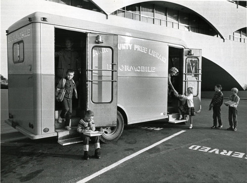 The Marin County Free Library Bookmobile, parked outside the Marin County Civic Center, circa 1962 [photograph]