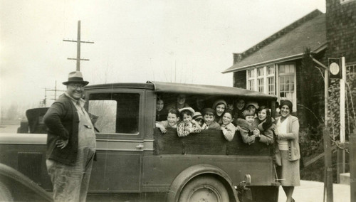 A group of children outside the Novato Branch of the Marin County Free Library, at the Community House, Marin County, California, circa 1928 [photograph]