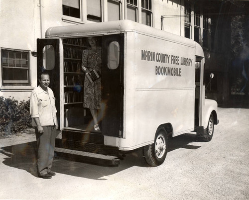 County Librarian Virginia Keating, and Perry McDonald, pose with the newly-established Marin County Free Library Bookmobile, October 1, 1948 [photograph]