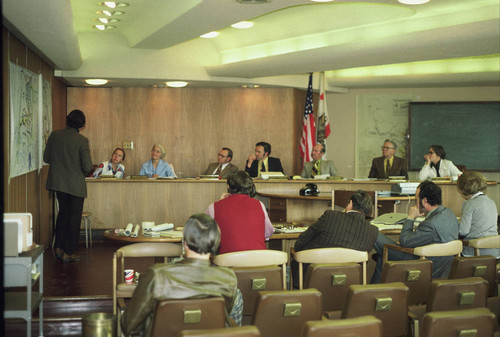 Marin County Parks Planner David Hansen presents the Parks Commission with proposals for County Service Areas 25 and 23, in the Planning Commission Chambers of the Marin County Civic Center, in San Rafael, 1975 [photograph]