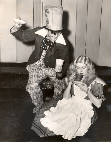 Pat Bulfin as the Mad Hatter, and Elaine Haslett as Alice, in the 1947 Mountain Play, Alice in Wonderland, performed on Mount Tamalpais [photograph]