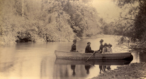 A group of vacationers boating on Paper Mill Creek (Laguinitas Creek), Taylorville, Marin County, California, 1889 [photograph]