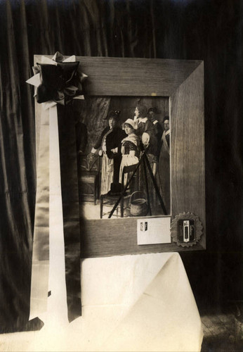 A framed picture showing Sarah Bernhardt (in Napoleon hat), and some of her company, who performed a scene from 'Une Nuit de Noel' in 1913, at San Quentin State Prison, Marin County California [photograph]