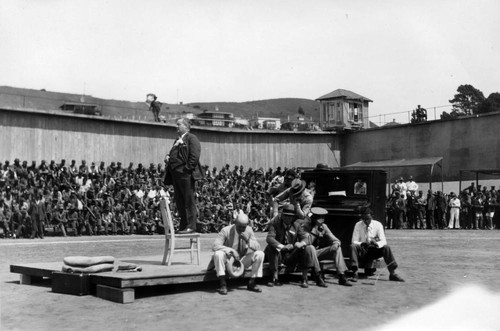 Officials addressing the crowd, San Quentin Little Olympics Field Meet, 1930 [photograph]