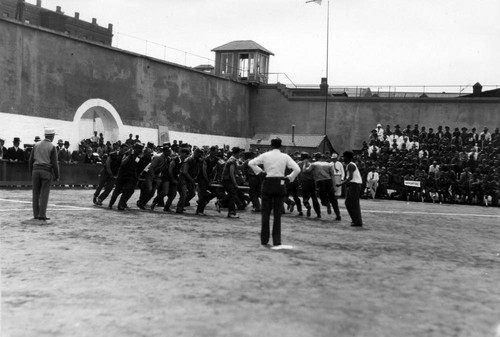 Centipede race (side view), San Quentin Little Olympics Field Meet, 1930 [photograph]