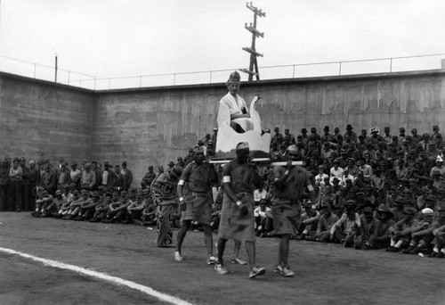 Prisoners in costume parading at the San Quentin Little Olympics Field Meet, 1930 [photograph]