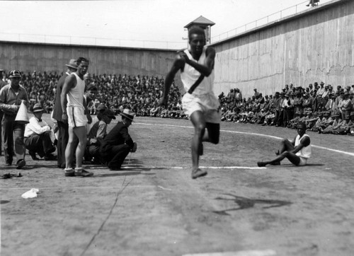 Long-jump competition, San Quentin Little Olympics Field Meet, 1930 [photograph]