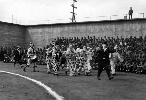 Procession of Clowns, (front view), San Quentin Little Olympics Field Meet, 1930 [photograph]