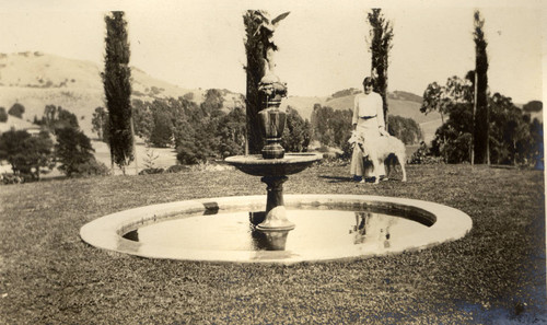 Alice Oge standing at the lower fountain at the Beale house in San Rafael, California, September 1913 [photograph]