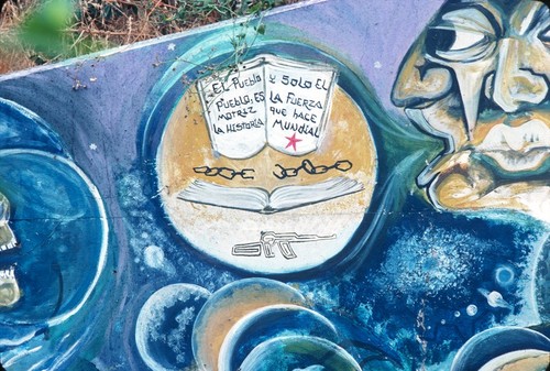 Chicano Park: Historical Mural: detail of an open book with inscription, broken chain and a gun