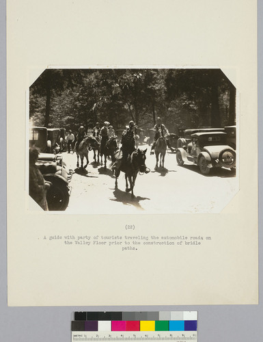 A guide with party of tourists traveling the automobile roads on the Valley Floor prior to the construction of bridle paths