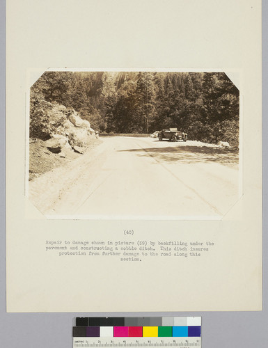 Repair to damage shown in picture (39) by backfilling under the pavement and constructing a cobble ditch. This ditch insures protection from further damage to the road along this section